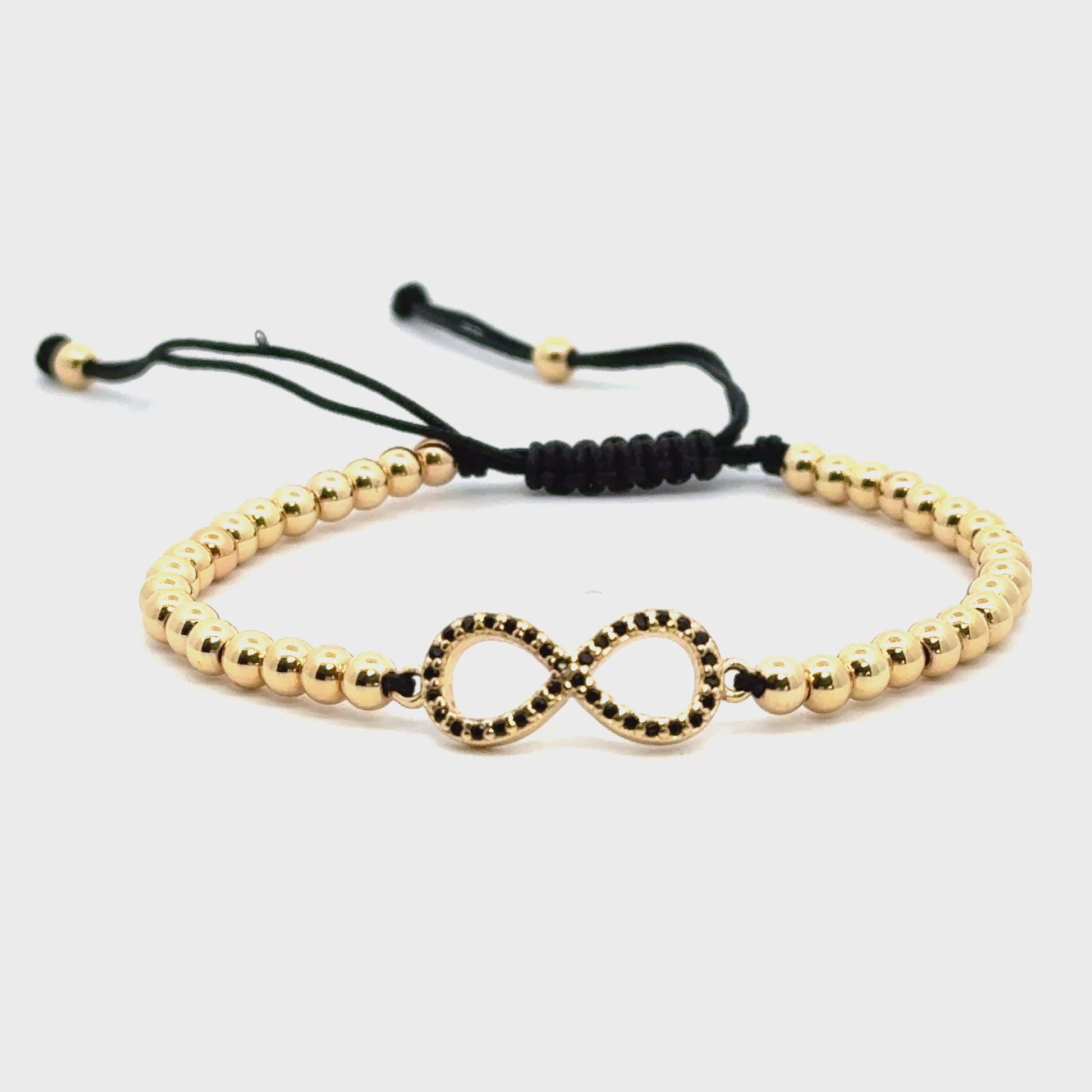 Bratara barbati din metal comun auriu cu charm infinit si cristale zirconia